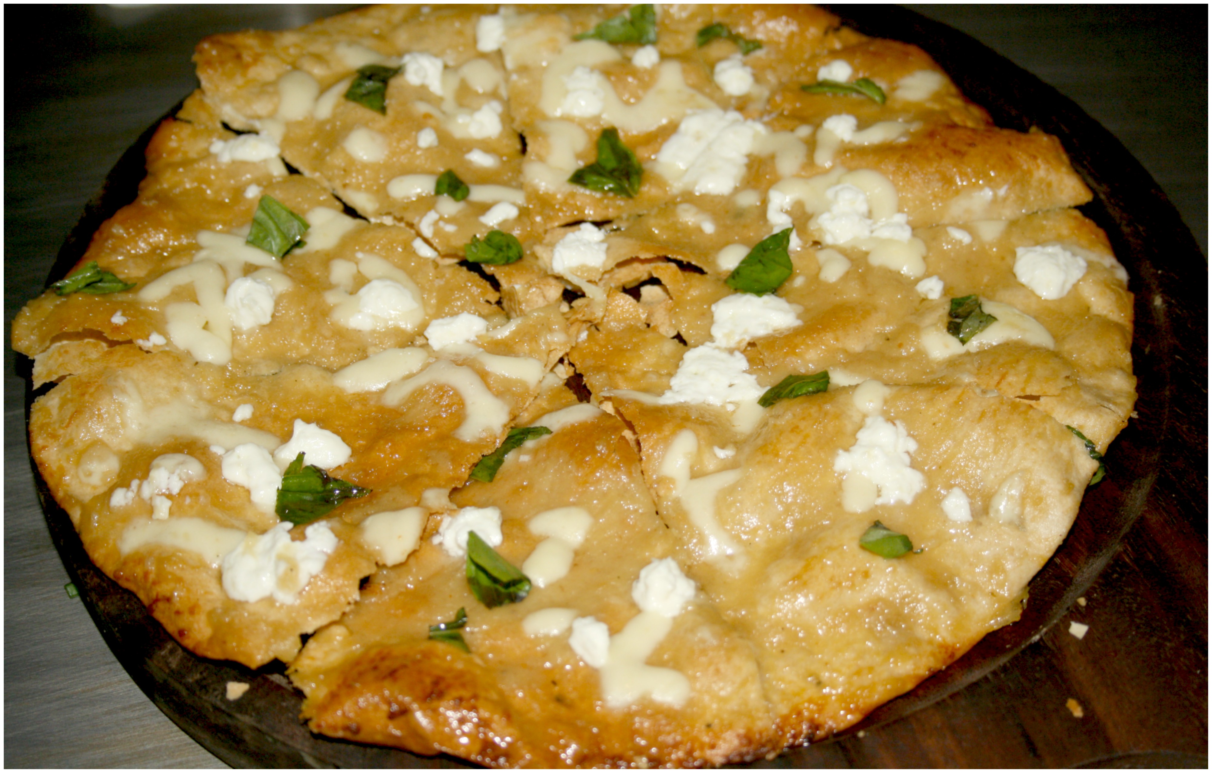Bianco Pizza – Feta Cheese  with Garlic Confit and Basil.
